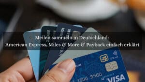 Reisekreditkarten in der Hand mit denen Membership Reward Punkte und Meilen gesammelt werden können